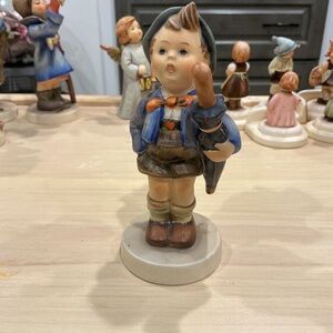 Hummel Boy Figurine with Blue Jacket and Brown Shorts